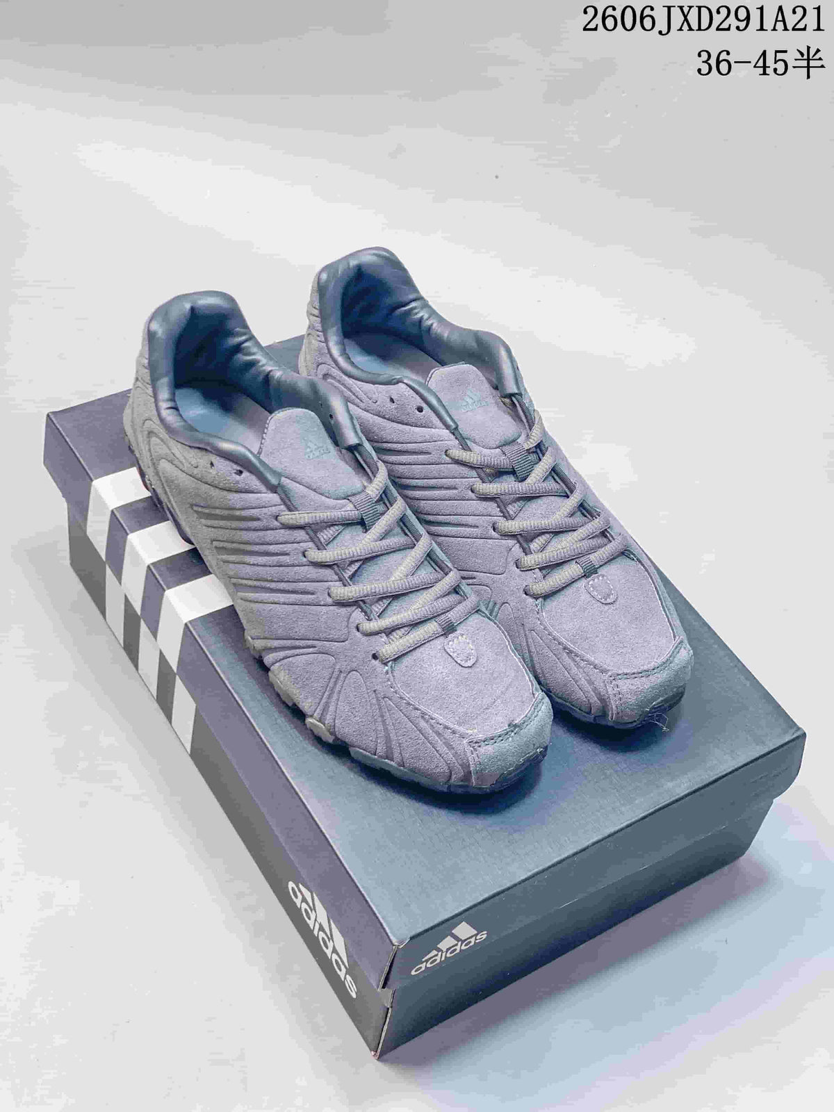 Pair of gray adidas Originals Ghost Sprint sneakers displayed on an adidas shoebox.