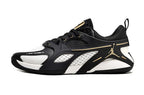 Side profile of a black and white Jordan Heir shoe with gold-tone details