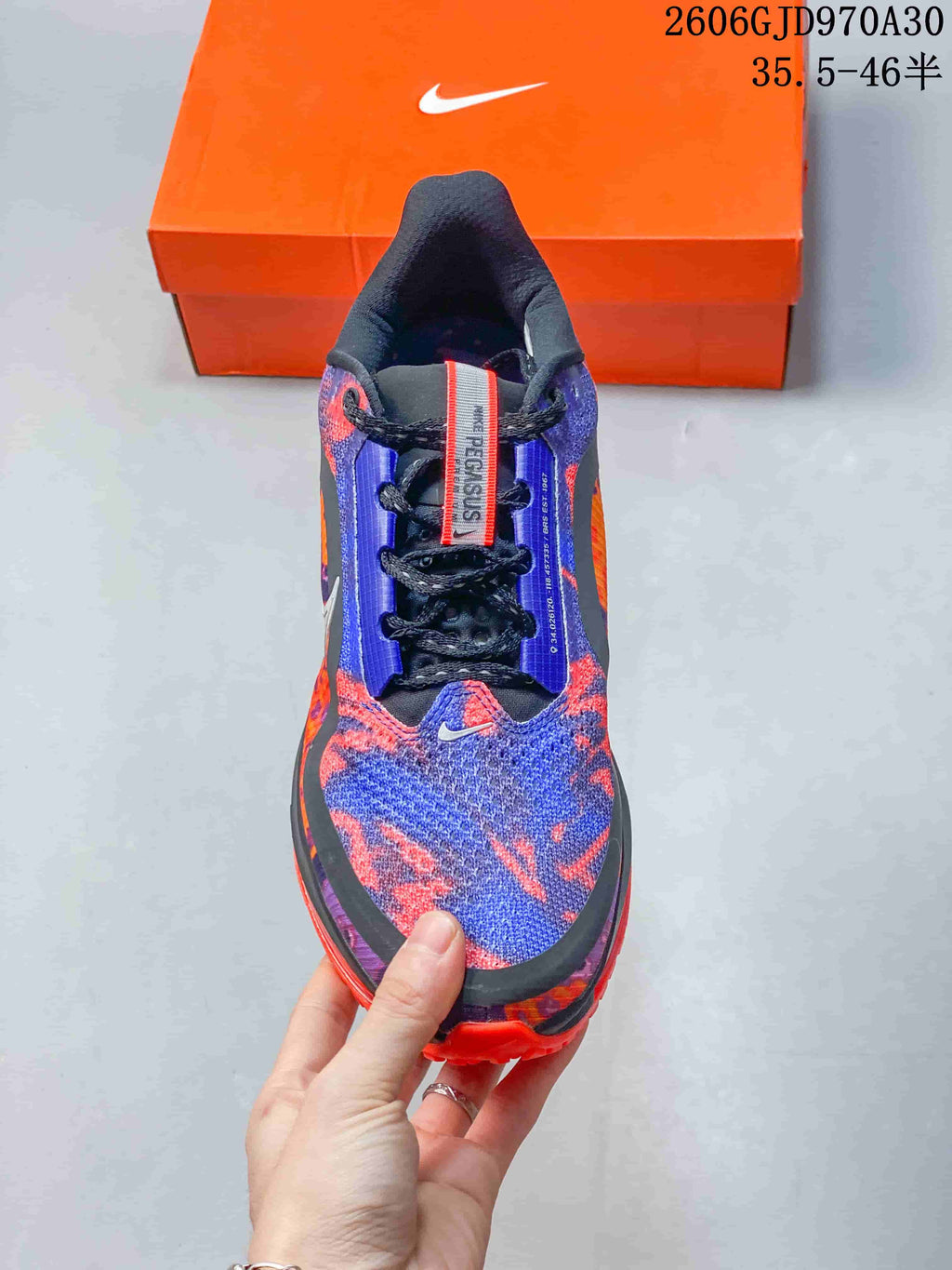 Top view showing the patterned upper, black laces, and tongue detail