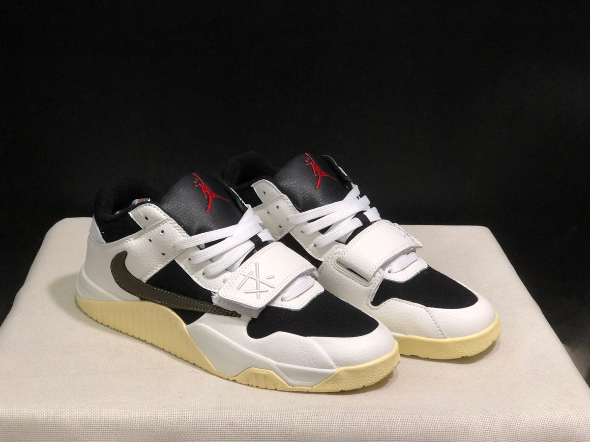 Three-quarter view of the pair highlighting the white upper, black panels, white laces, and contrasting outsole.