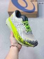 Angled side view of the white and neon yellow sneaker showing the ASICS side branding and patterned forefoot detailing.