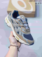 Angled side view of the Asics GEL-Kayano 14 sneaker showing the layered upper, mesh panels, and outsole.