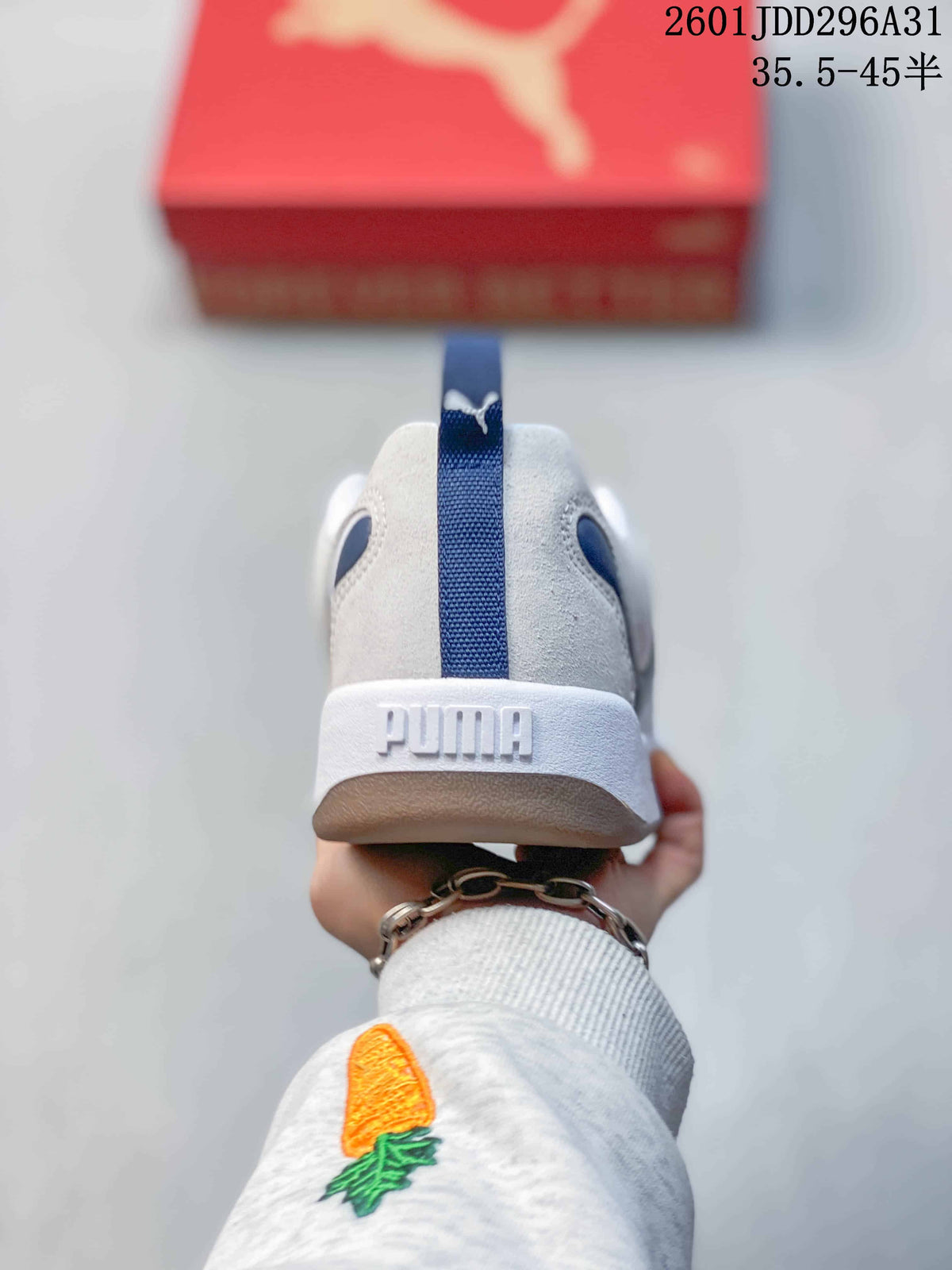 Rear view showing the blue heel pull tab, white heel counter, and raised PUMA branding.