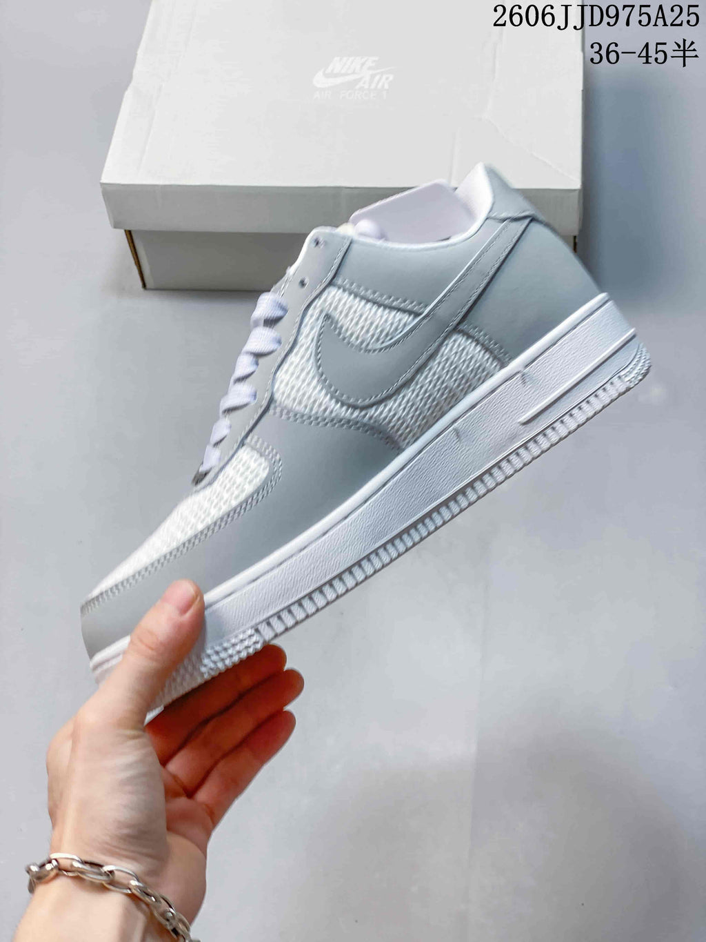 Side view of the sneaker showing the layered side panels, Nike Swoosh, white midsole, and textured outsole.
