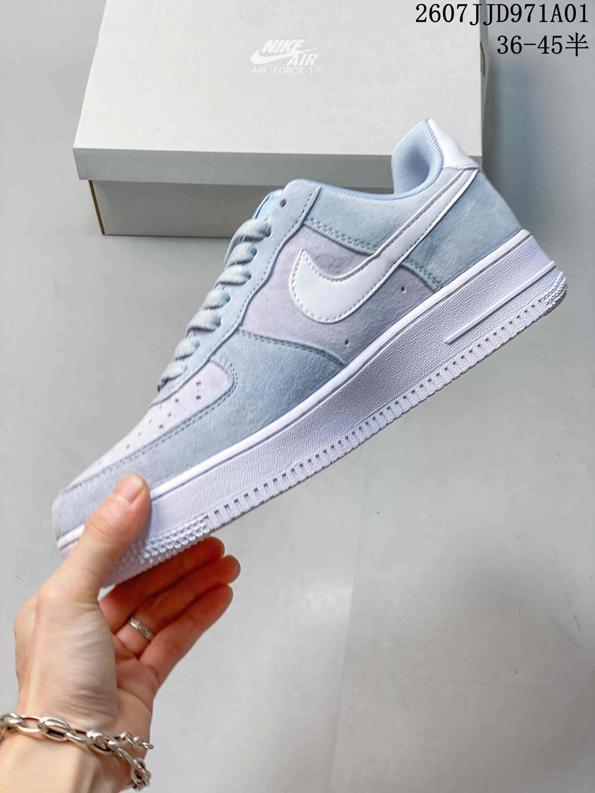 Side view of a pastel blue and lavender low-top sneaker