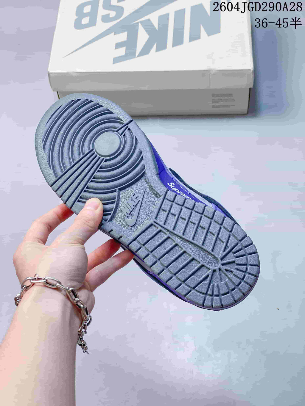 Close-up of the sneaker's gray rubber outsole and tread