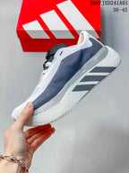Side view of a white and gray Adidas Hyperboost Edge M shoe