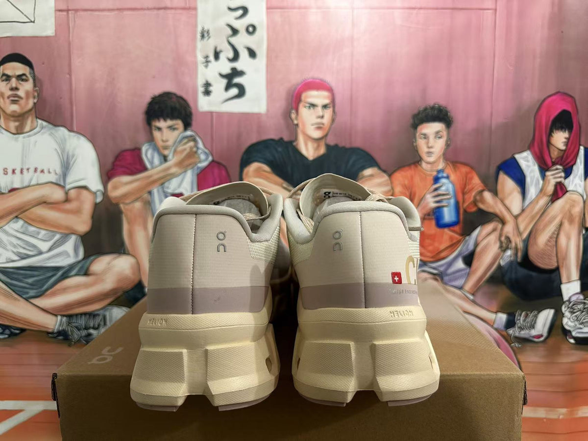 Rear view of beige On sneakers showing heel branding and sculpted soles