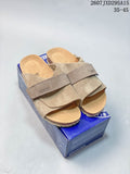 Pair of taupe Birkenstock-style buckle sandals displayed on a blue shoebox; the image shows style code 2607JXD295A15 and size range 35–45.