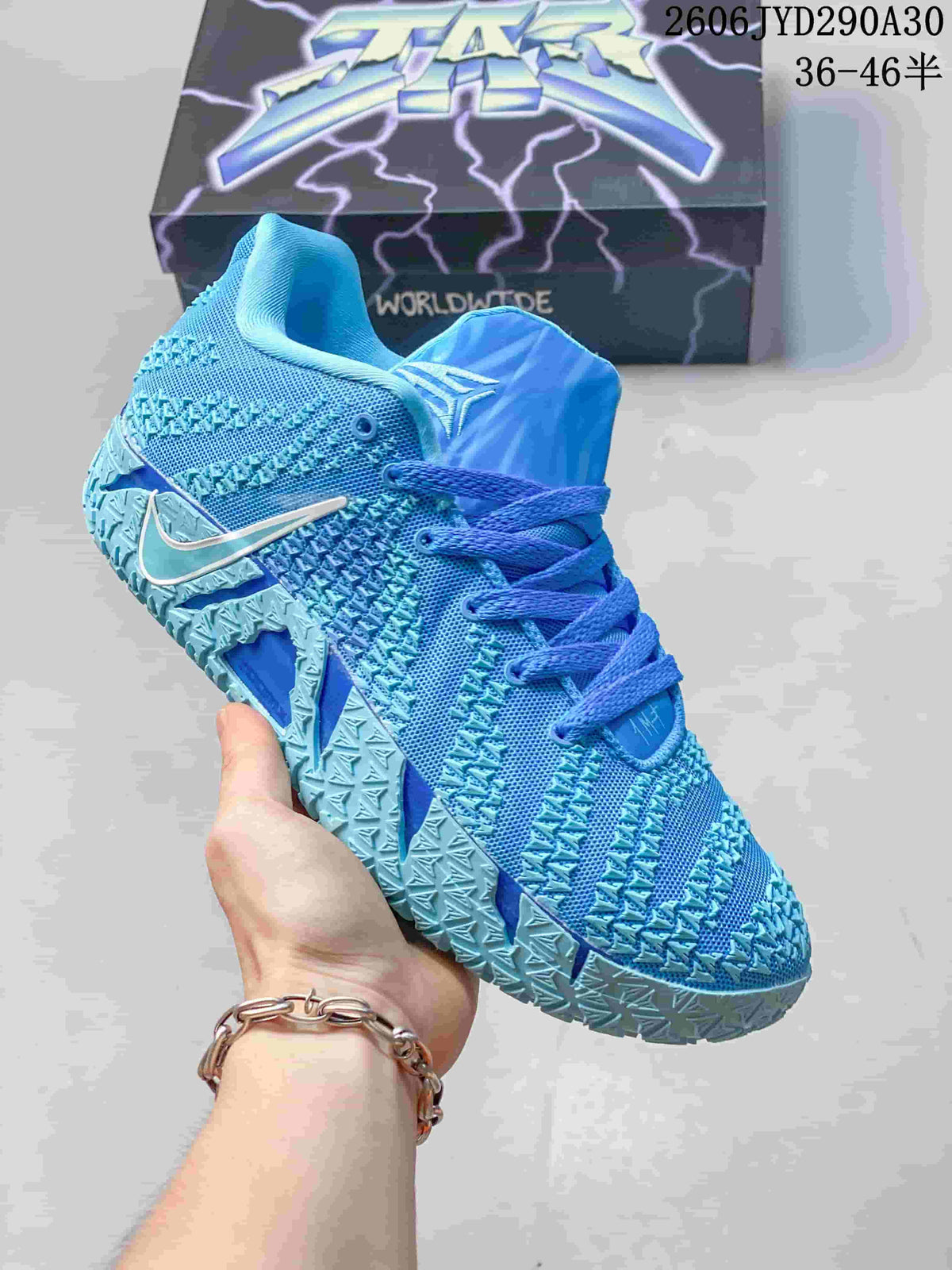 Blue Nike Ja 3 basketball shoe with a contrasting blue tongue and laces