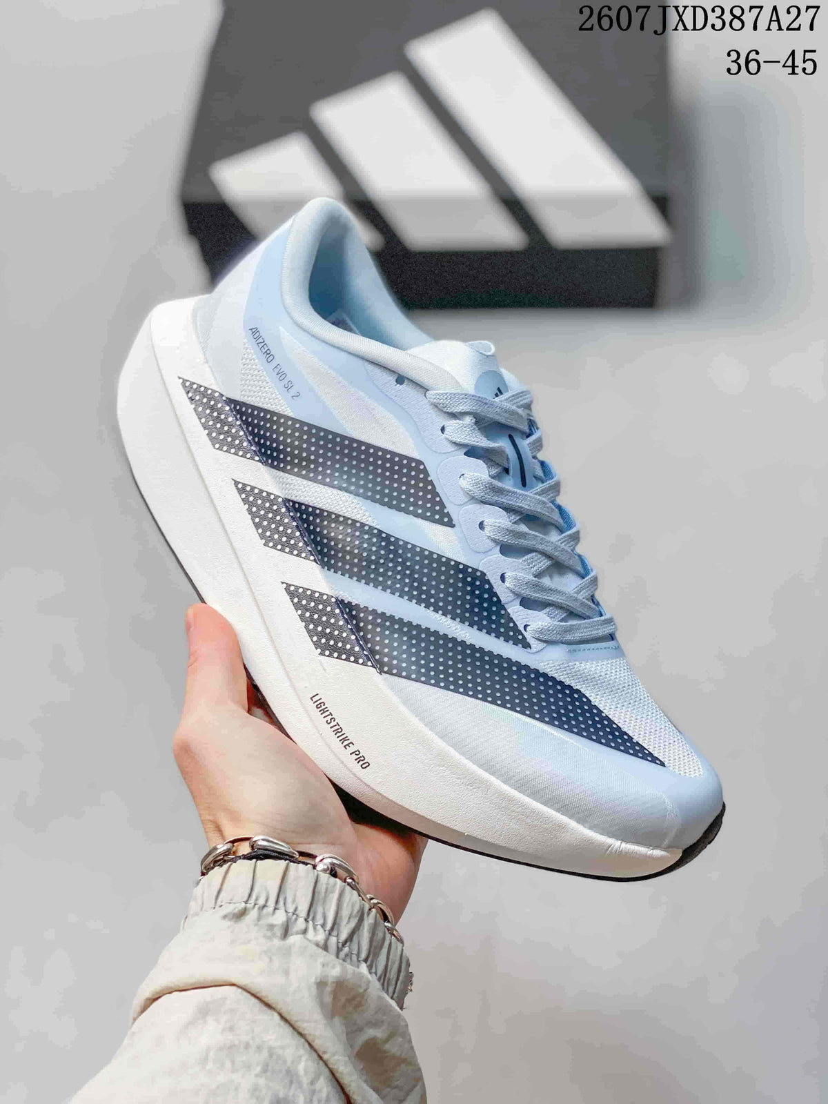 Angled side view of the shoe showing the light blue upper, dotted stripes, white sole, and visible “LIGHTSTRIKE PRO” marking.