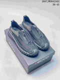 Pair of charcoal gray ECCO zip-front mesh-look casual shoes on a branded box.