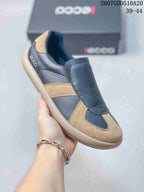 Angled close-up of a navy and tan ECCO sneaker with the ECCO logo visible at the side; image text shows style code 2607GDD510A20 and sizes 39–44.