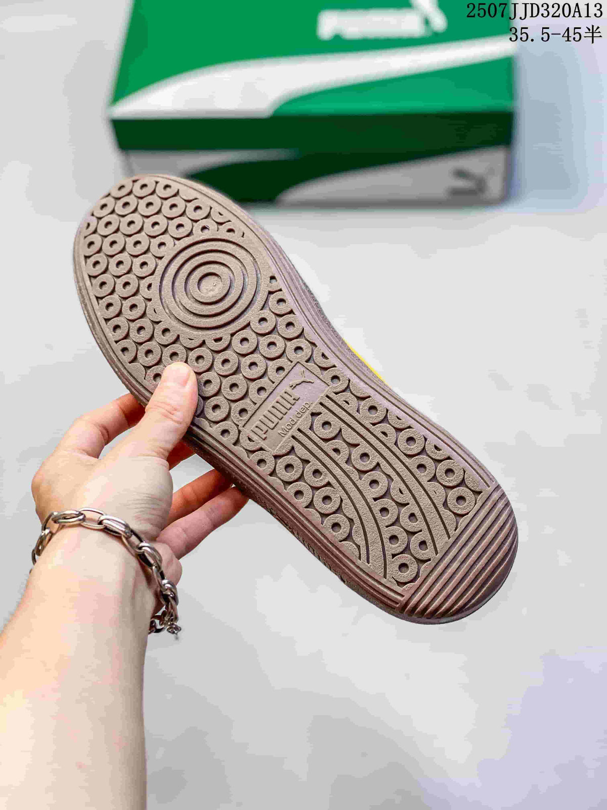 Close view of the brown PUMA outsole showing its circular traction pattern.