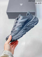 Side profile highlighting the low-top shape, mesh upper panels, reinforced overlays, and lugged sole.