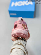 Rear view of a pink HOKA sandal showing the heel strap, pull loop and layered outsole; overlay shows size range 36–40.