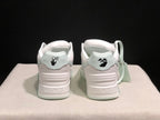 Rear view showing padded heel panels, branding graphics and pale mint outsole accents.