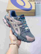 Angled side view of the gray, navy and pink ASICS Tiger Gel-Kahana 8 sneaker with a rugged outsole.