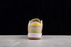 Rear view showing the padded heel, embroidered Nike branding, white midsole, and gum outsole