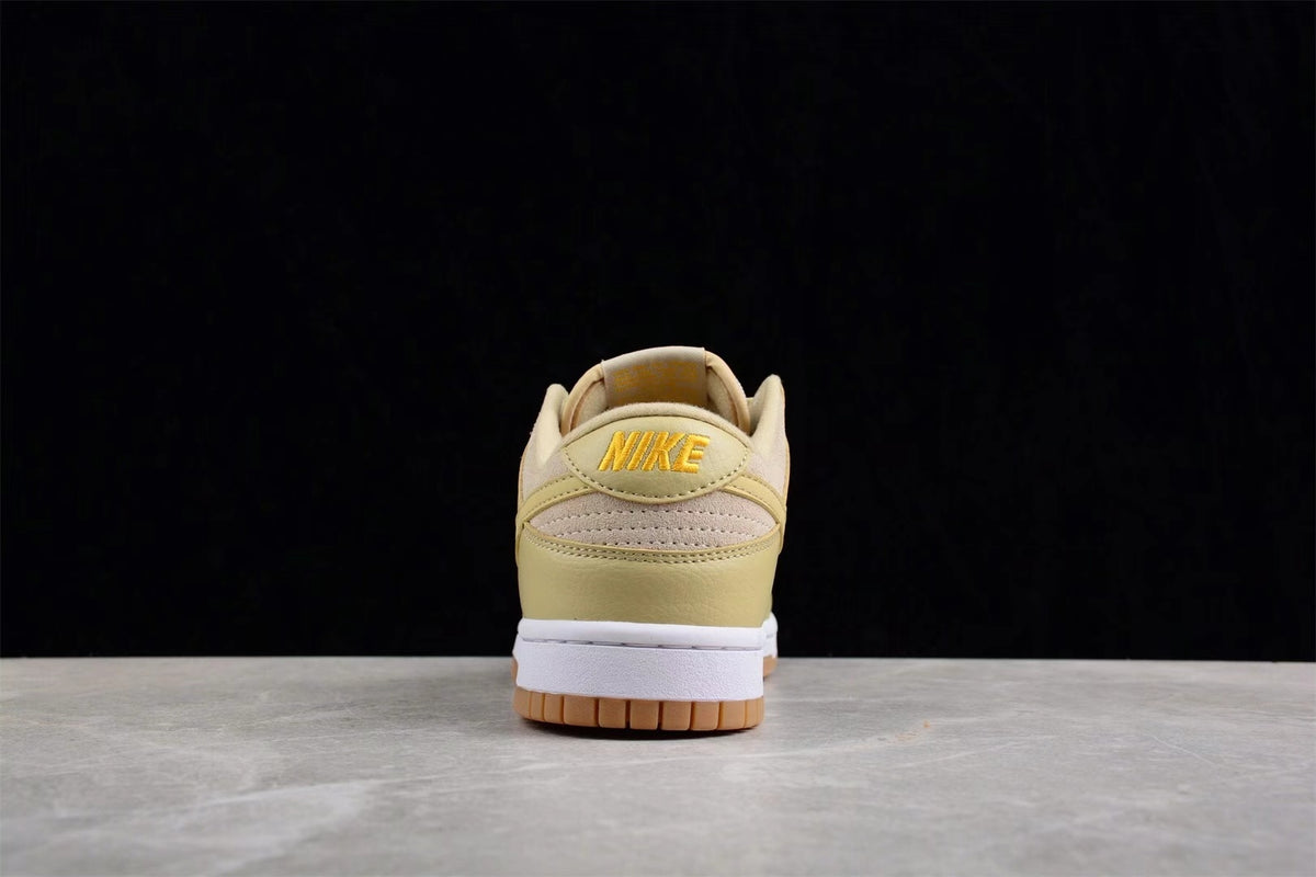 Rear view showing the padded heel, embroidered Nike branding, white midsole, and gum outsole