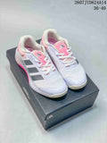 Pair of white, pink and gray adidas Dropset 4 training shoes displayed on an adidas shoe box.