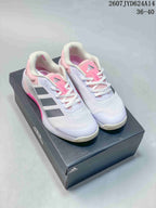 Pair of white, pink and gray adidas Dropset 4 training shoes displayed on an adidas shoe box.