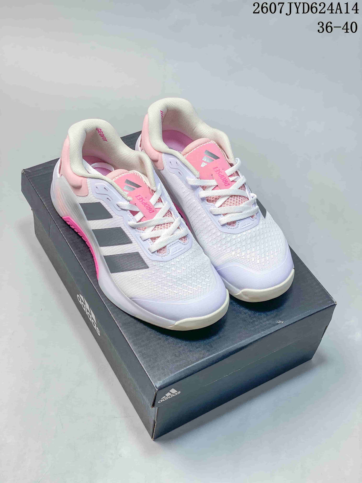 Pair of white, pink and gray adidas Dropset 4 training shoes displayed on an adidas shoe box.