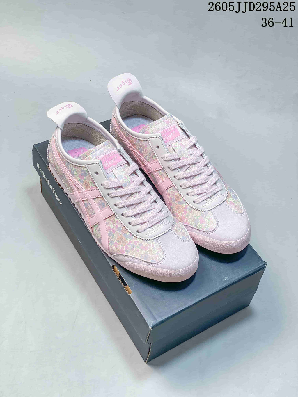 Pink floral Onitsuka Tiger low-top sneakers displayed on a branded shoe box; image text shows JD295A25 and sizes 36–41.