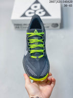 Top view showing the lace pattern, dark gray toe box, and contrasting neon green details.