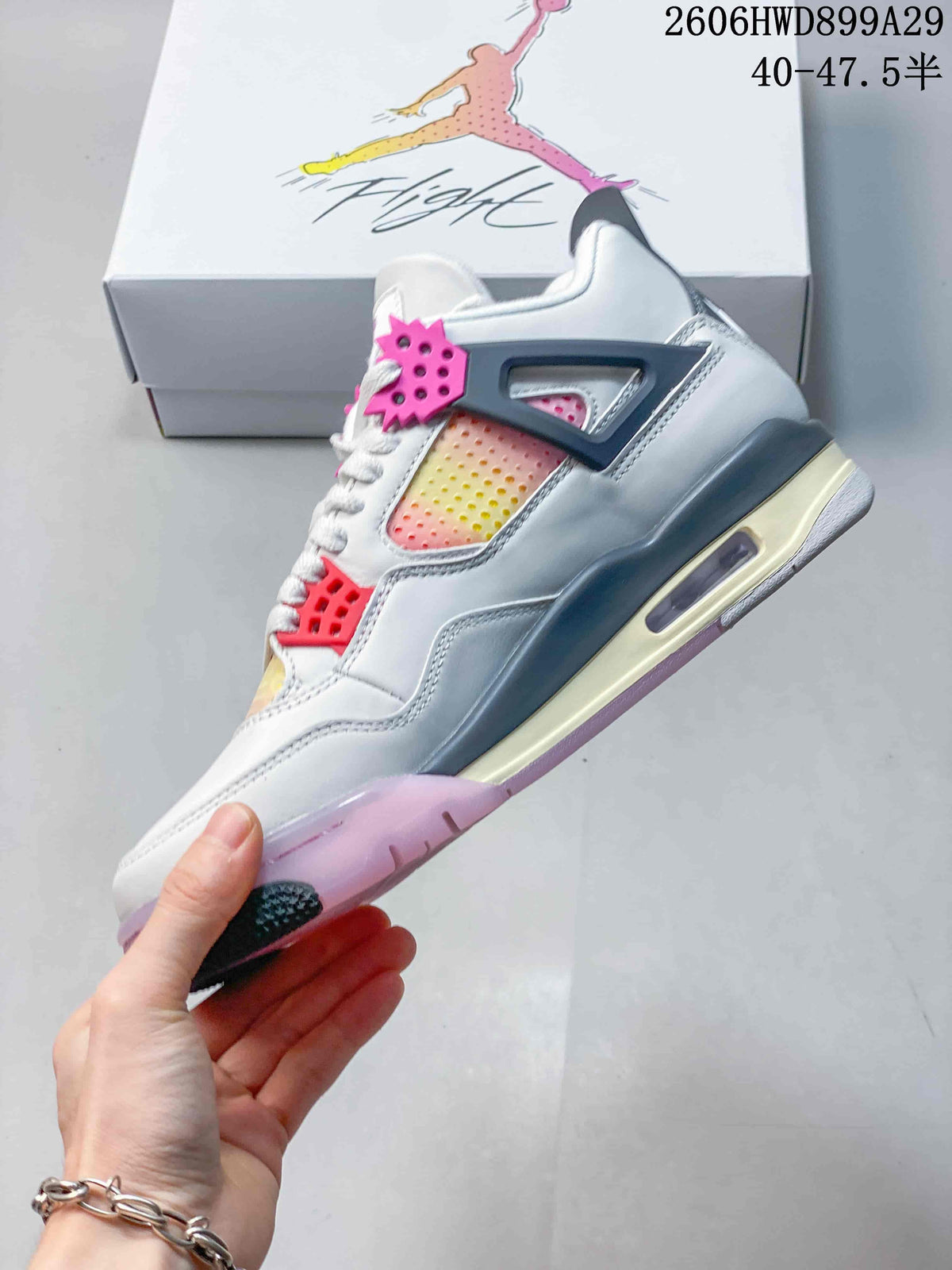 Side view highlighting gradient perforated panels, pink lace supports, and the heel Air unit.