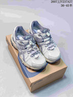 Pair of ASICS Gel-Kahana 8 FL sneakers shown on an ASICS shoe box from a front three-quarter angle.