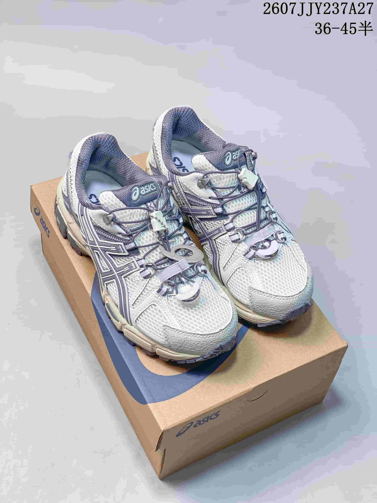 Pair of ASICS Gel-Kahana 8 FL sneakers shown on an ASICS shoe box from a front three-quarter angle.