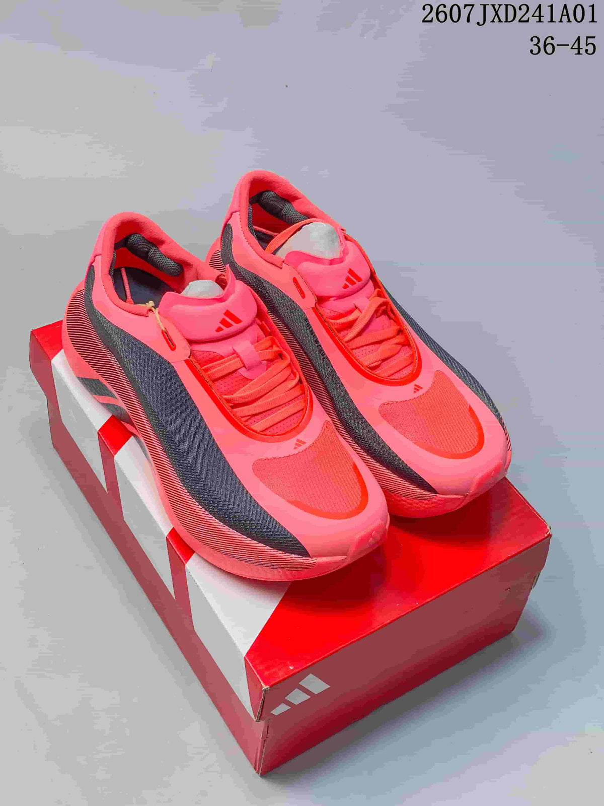 Pair of bright pink and dark-panel adidas Hyperboost Edge running shoes on a shoebox