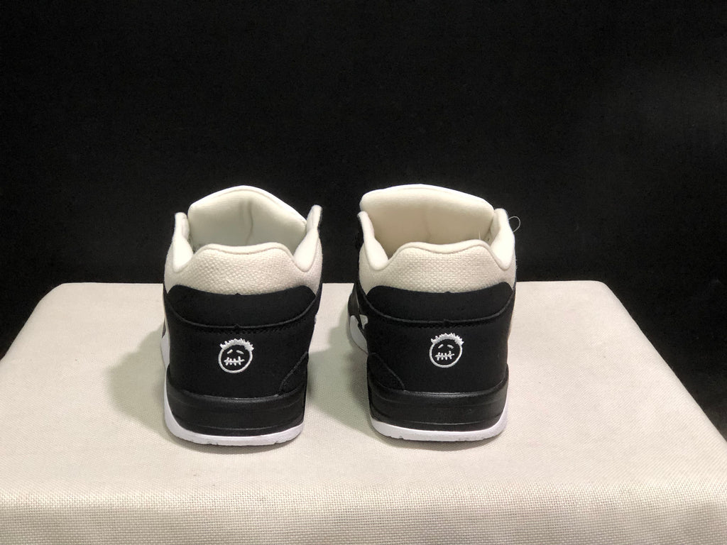 Rear view showing the black heel panels, white collar details, and circular heel branding.