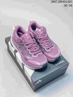 Pair of purple Adidas Terrex low-top sneakers displayed on a shoe box