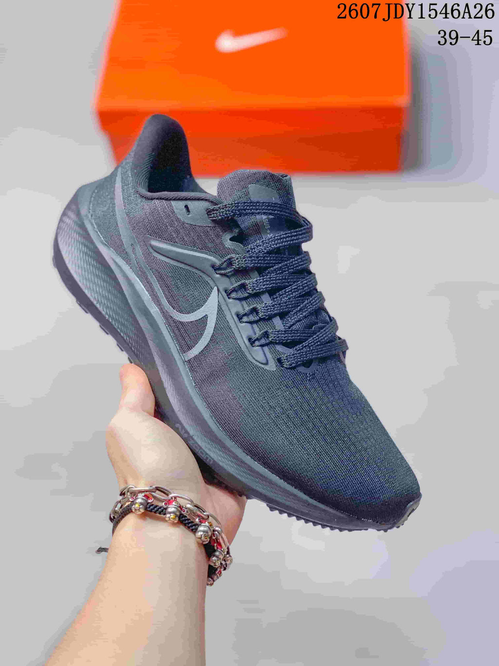 Dark gray Nike Air Zoom Pegasus 39 sneaker with matching dark laces and a tonal outsole.