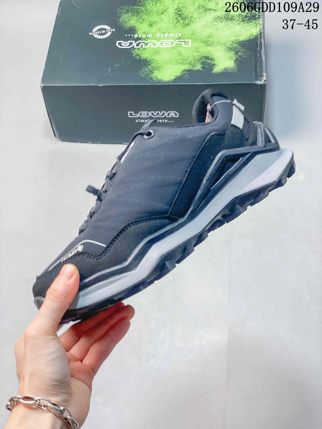 Side view of the dark gray outdoor shoe and chunky sole