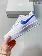 Side view of a white low-top sneaker with a blue Swoosh