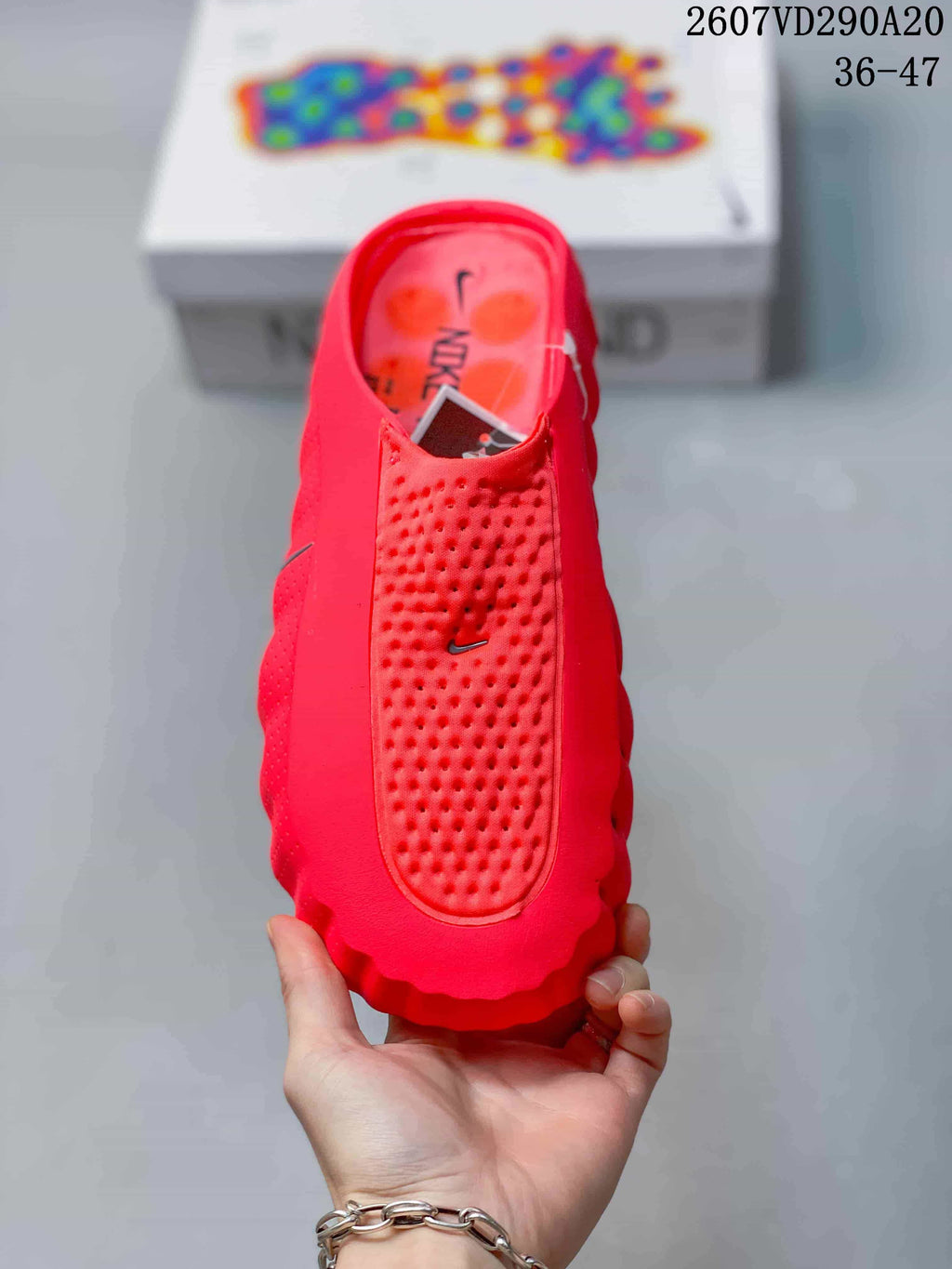 Top view of the red slide showing the perforated footbed and Nike Swoosh detail.