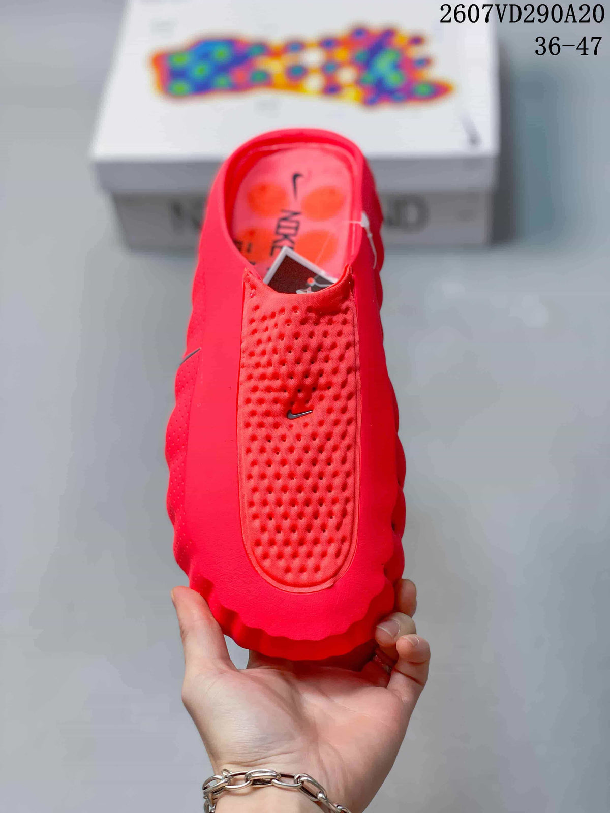 Top view of the red slide showing the perforated footbed and Nike Swoosh detail.