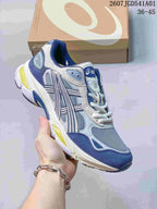 Angled side view of the blue and gray sneaker with contrasting sole accents