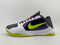 Side view of a Nike low-top basketball shoe in white, purple, charcoal, and lime with dark red laces and a speckled midsole