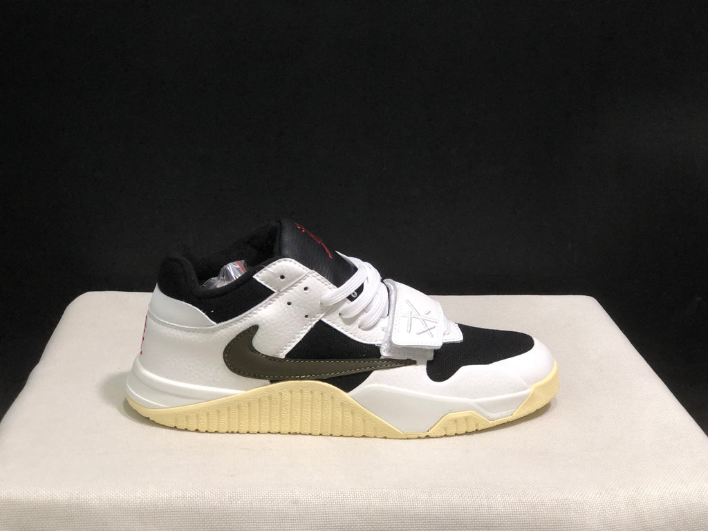 Single side profile of the sneaker against a dark background, showing the white and black color blocking and textured outsole.