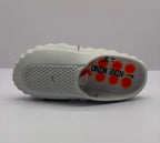 Top view of a gray Nike slide sandal showing the perforated footbed and printed Nike insole branding.