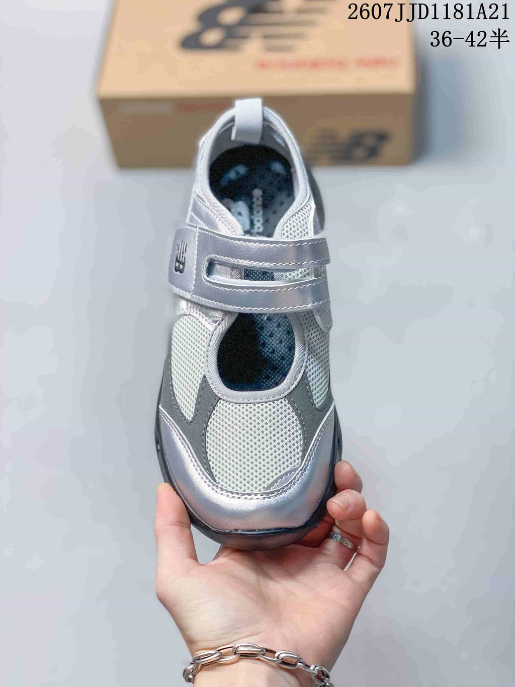 Top view showing the mesh toe area, open upper panel and overlapping hook-and-loop straps.