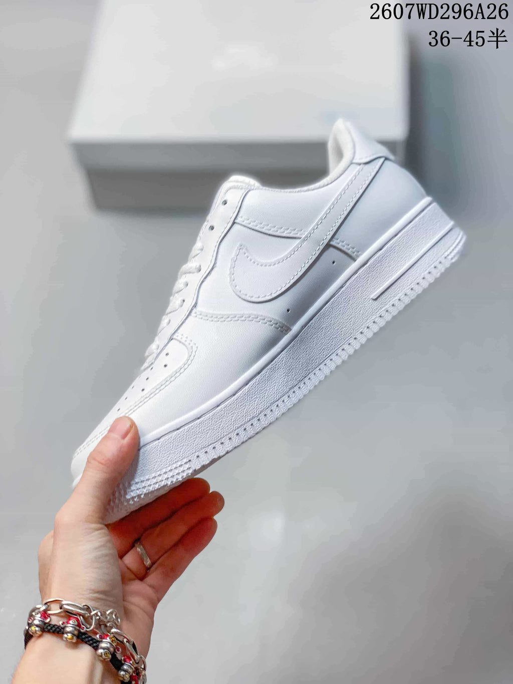 Side view of a white low-top Nike sneaker showing the Swoosh, stitched panels and raised sole.