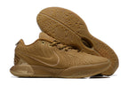 Brown Nike basketball shoes with tonal details and gum-colored outsoles.