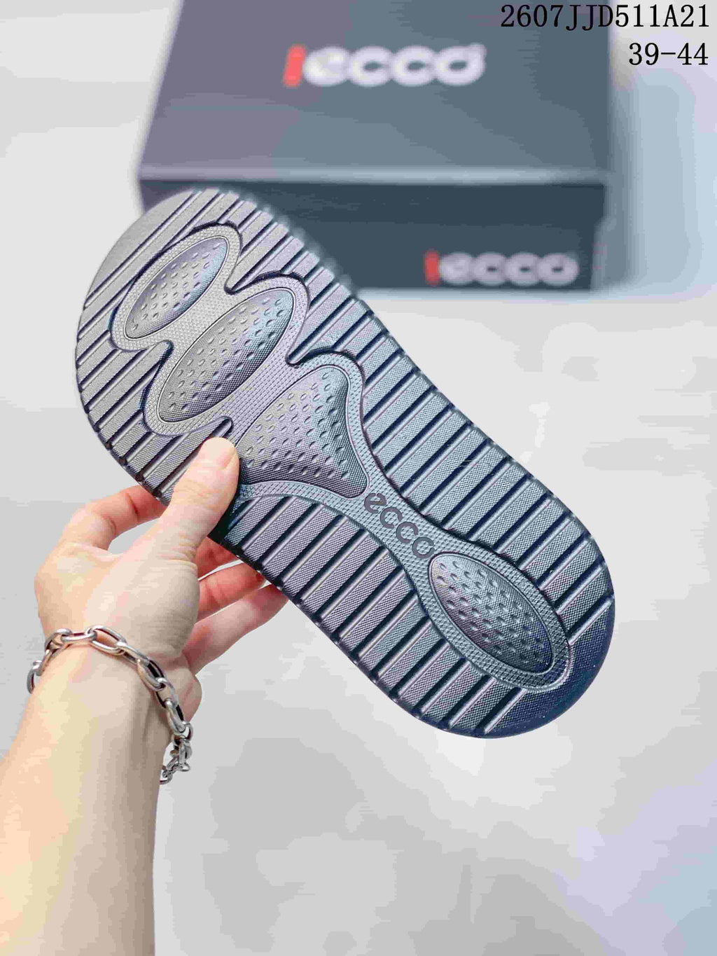 Close view of the sandal outsole showing a textured tread pattern and ECCO branding.