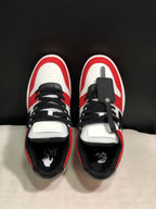 Top view showing black laces, white perforated toe boxes, padded collars, and branded insoles.