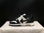 Side profile showing the low-top silhouette, contrasting arrow-style side detail, and layered outsole.